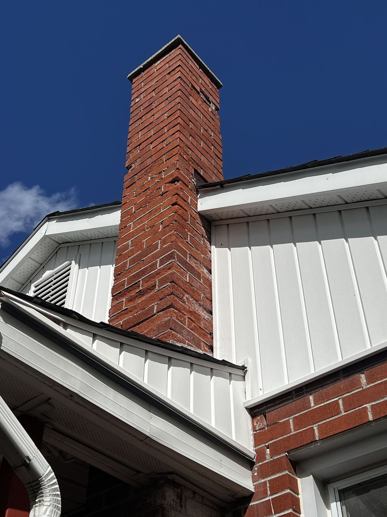 Tall old red-brick chimney before it was taken down